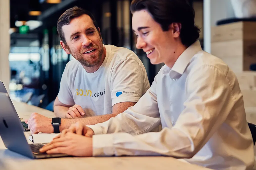 Teammates sharing ideas and working together around a table.
